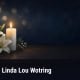 Fostoria News Memorial candle with lilies for Linda Lou Wotring obituary.